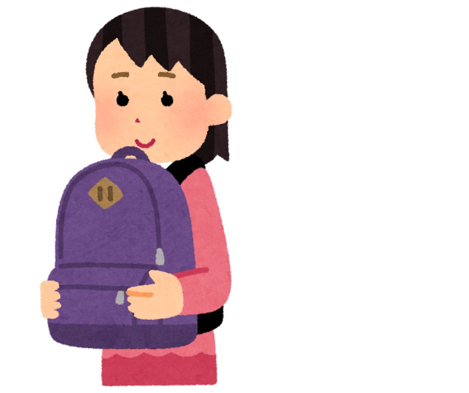 リュックを前に抱える女性
