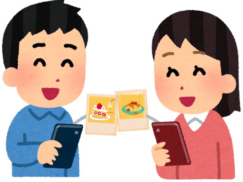 写真をエアドロップする二人