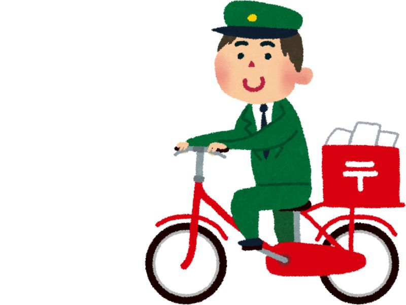 郵便配達員が郵便物を乗せた自転車に乗っている