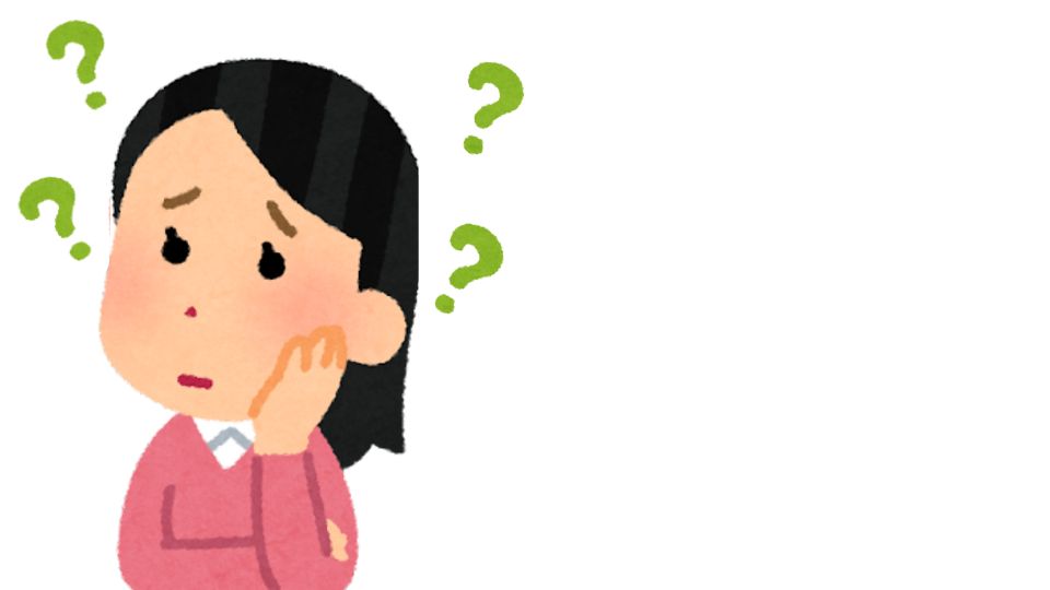 首をかしげる女性